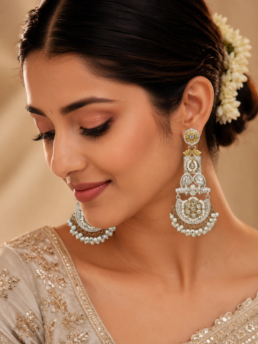 German silver pearl-style crystal chandelier earrings worn by a model