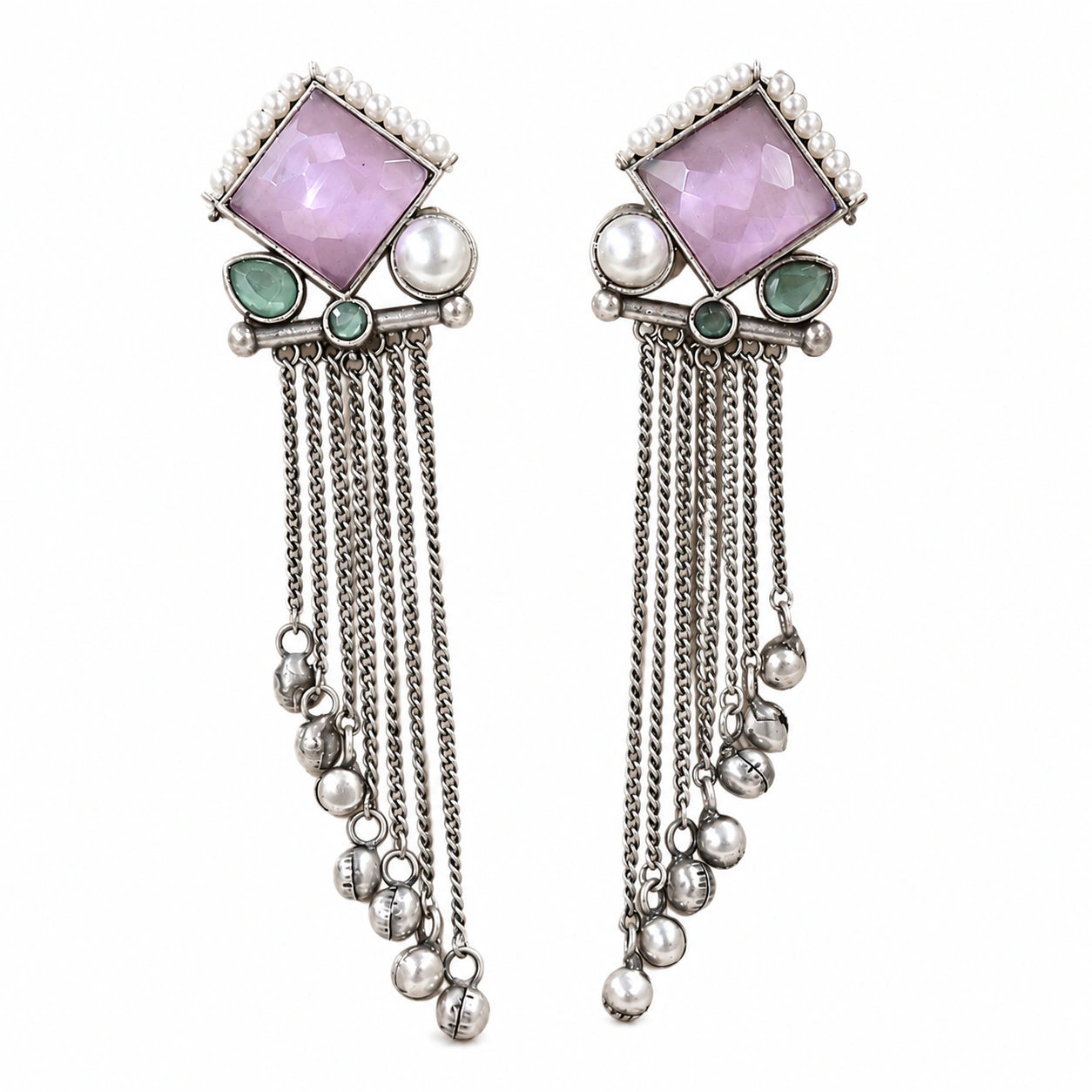 Angled view of German silver pink pearl-style dangle earrings