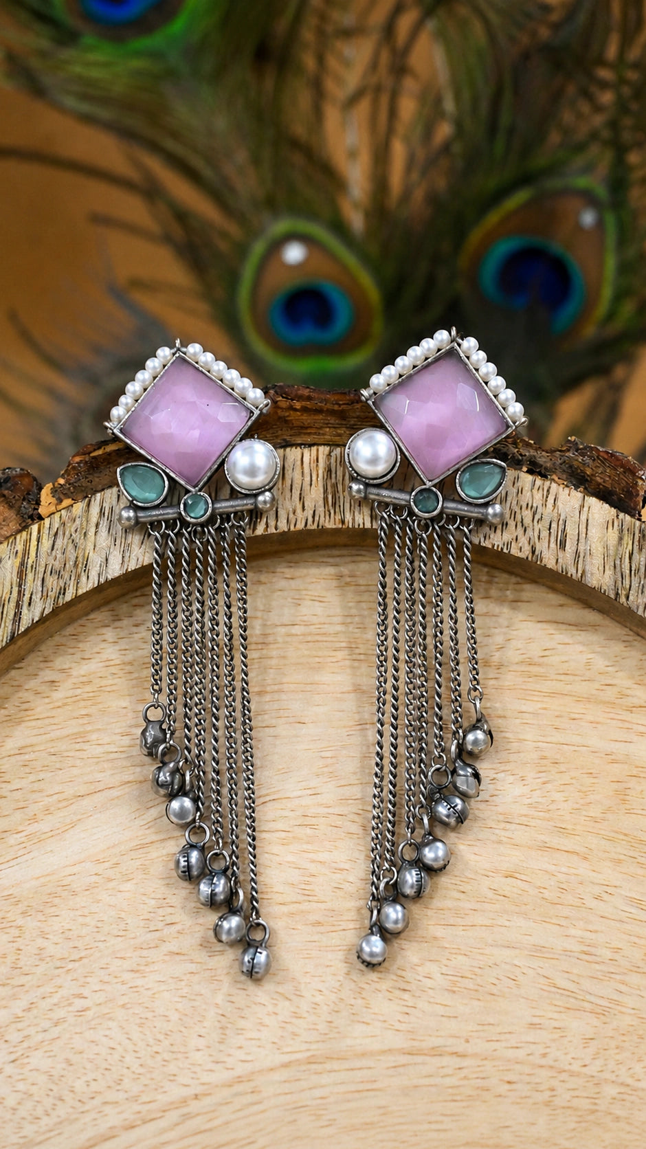 Close-up ear view showing pink accents and pearl-style hanging details