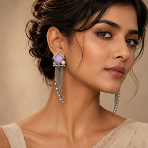 Close-up of pink accents, pearl-style beads and German silver dangle detailing