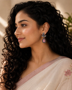 Alternate model view of pink teardrop bird pearl-style dangle earrings