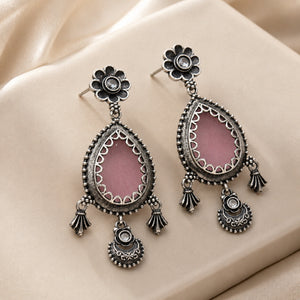 Angled view of German silver pink teardrop floral dangle earrings