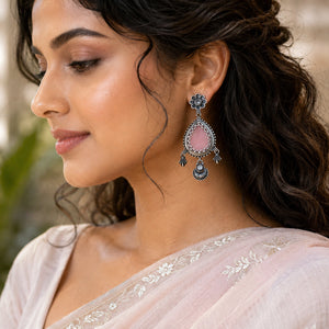 Close-up of pink teardrop stones and German silver floral detailing