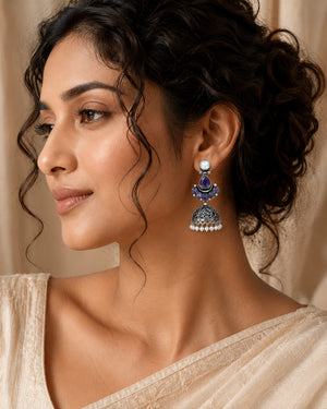 German silver purple pearl leaf dome jhumka earrings worn by a model