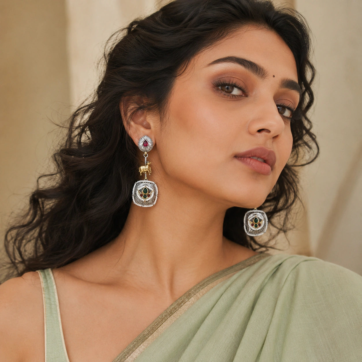 Close-up of rani pink accents, cow charms and pearl-style chandelier detailing