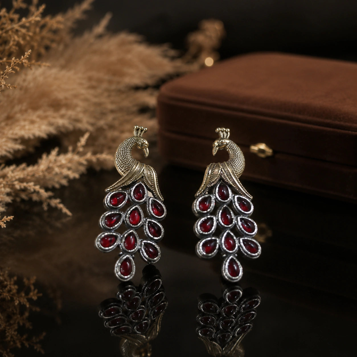 Product details card for German silver red peacock chandelier earrings