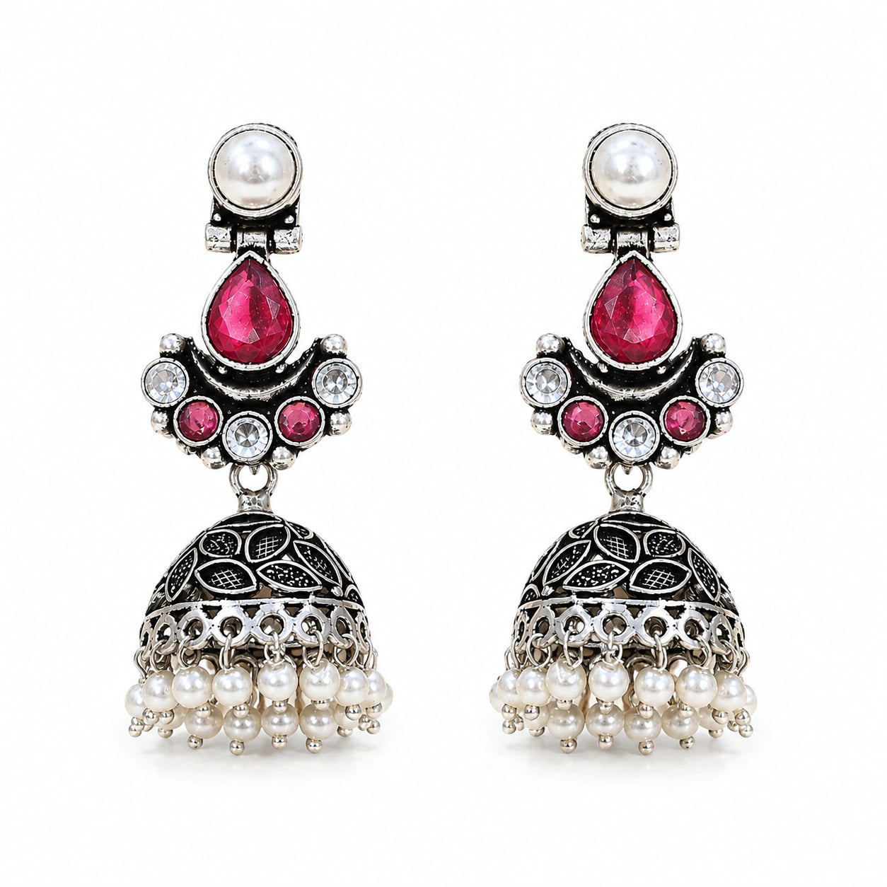 Angled view of German silver ruby-tone pearl leaf jhumka earrings