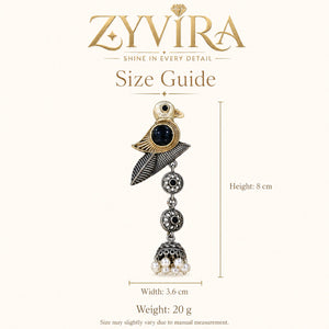 Angled view of German silver sparrow pearl dangle earrings