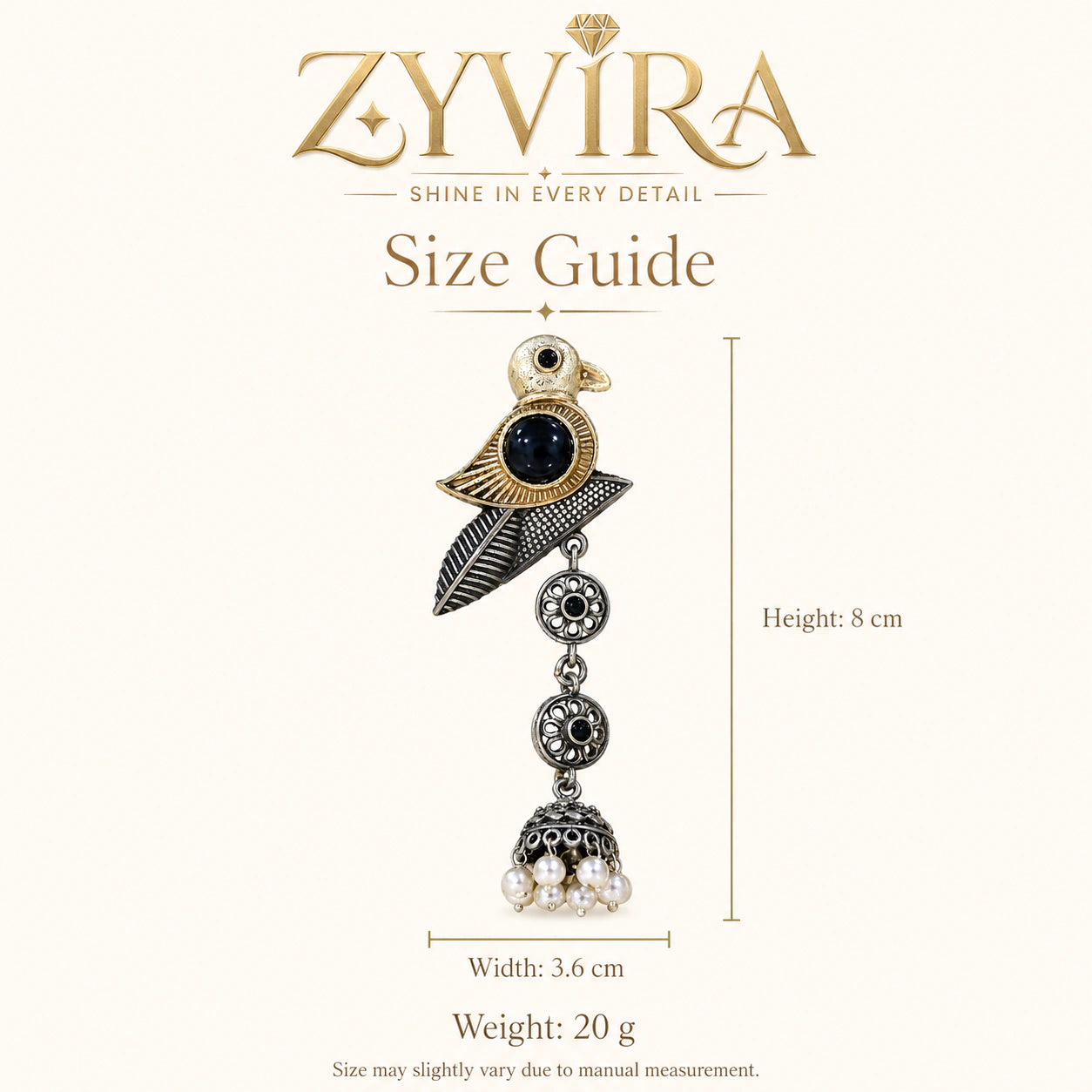 Angled view of German silver sparrow pearl dangle earrings
