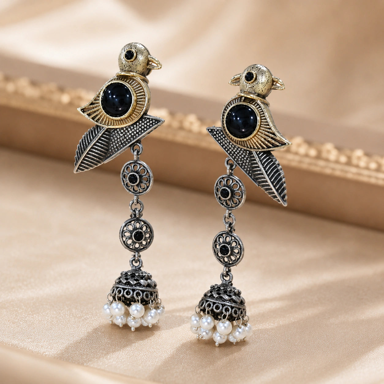 Sparrow pearl dangle earrings styled in an elegant jewellery flat lay