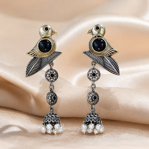 Close-up of sparrow motifs and pearl-style dangle detailing