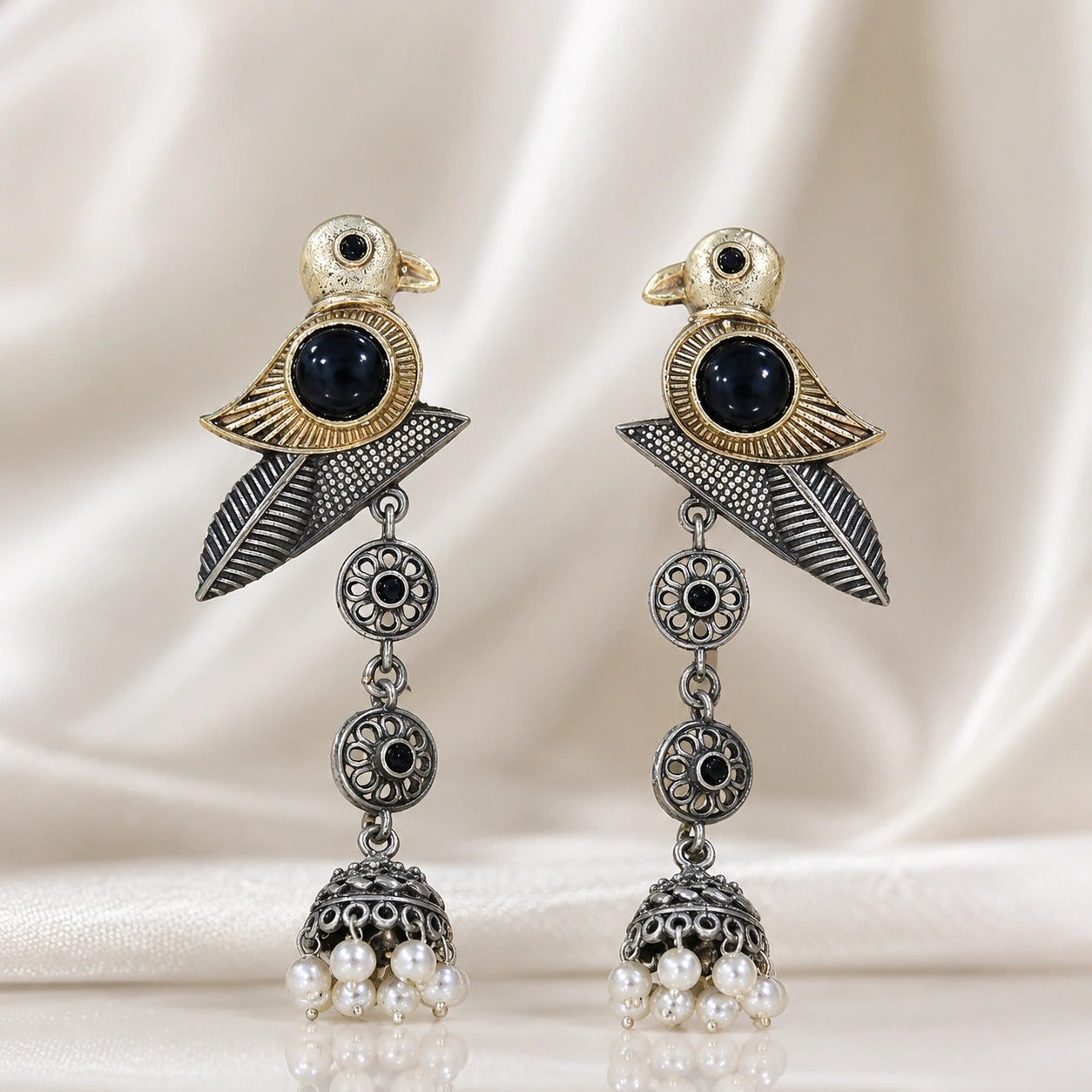 Product details card for German silver sparrow pearl dangle earrings