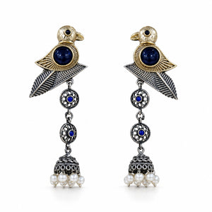 Sparrow pearl-style jhumka earrings styled in an elegant jewellery flat lay