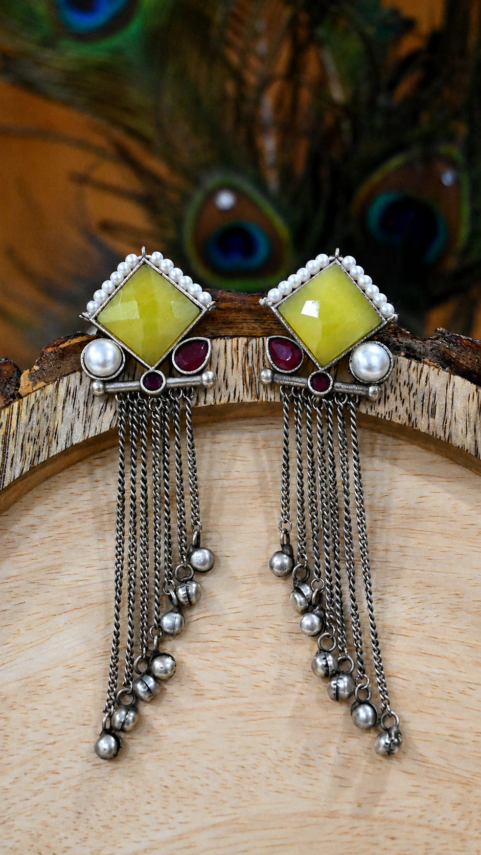 Close-up ear view showing the layered yellow, maroon and pearl-style fringe