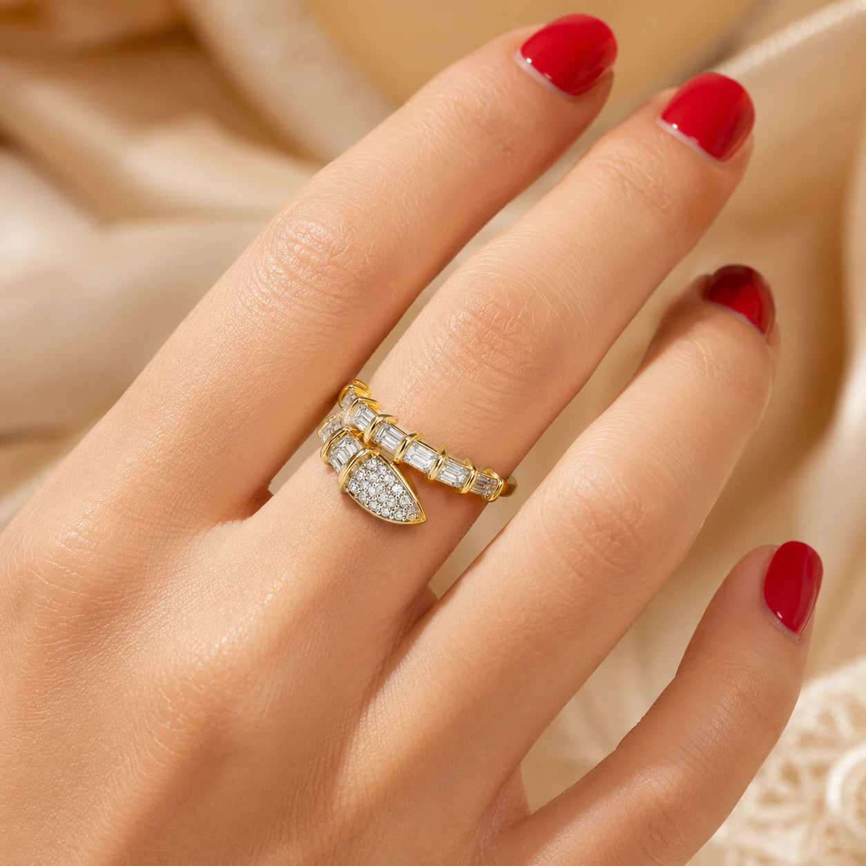 Angled view of the gold baguette crystal wrap ring