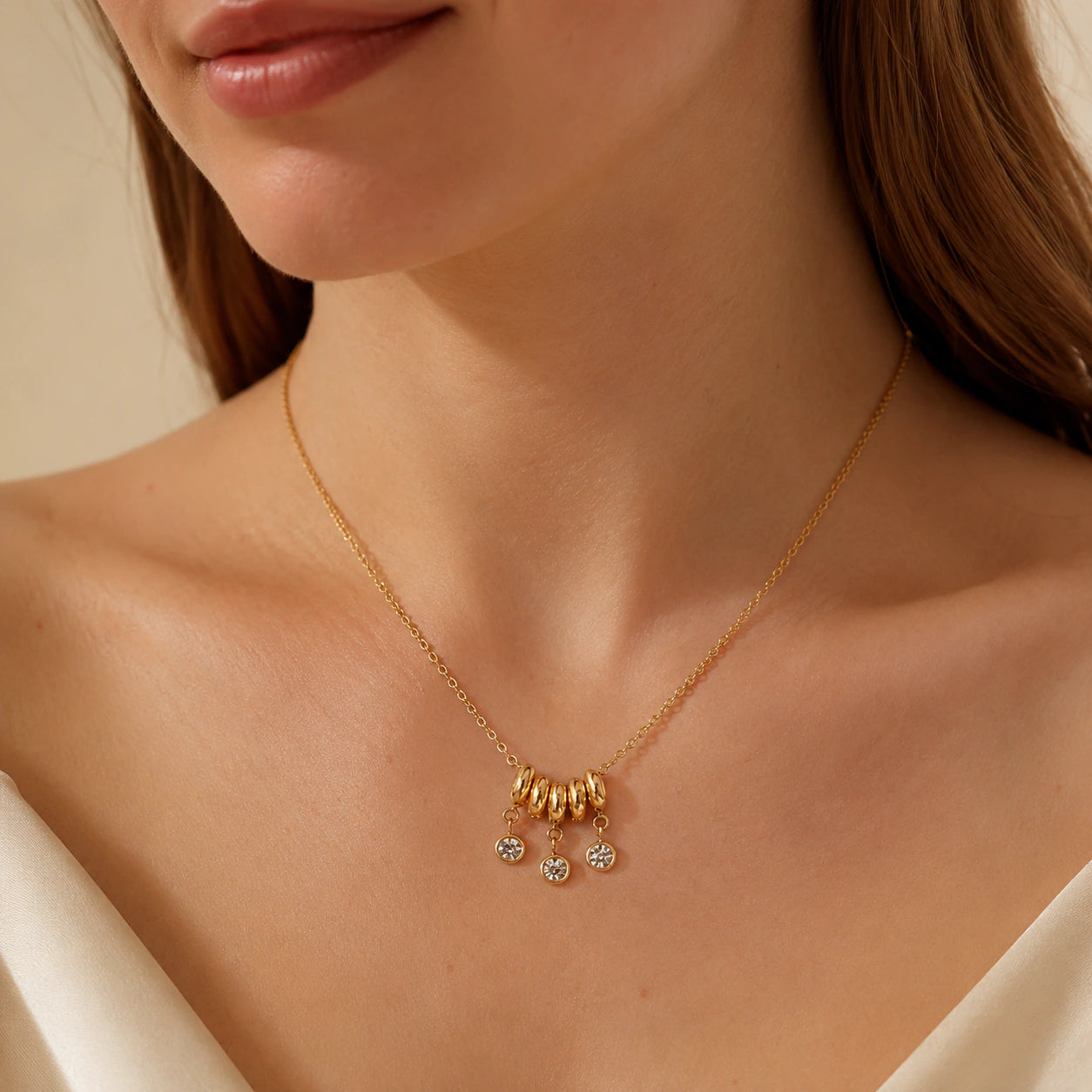 Gold bead-cluster necklace styled in an elegant jewellery flat lay
