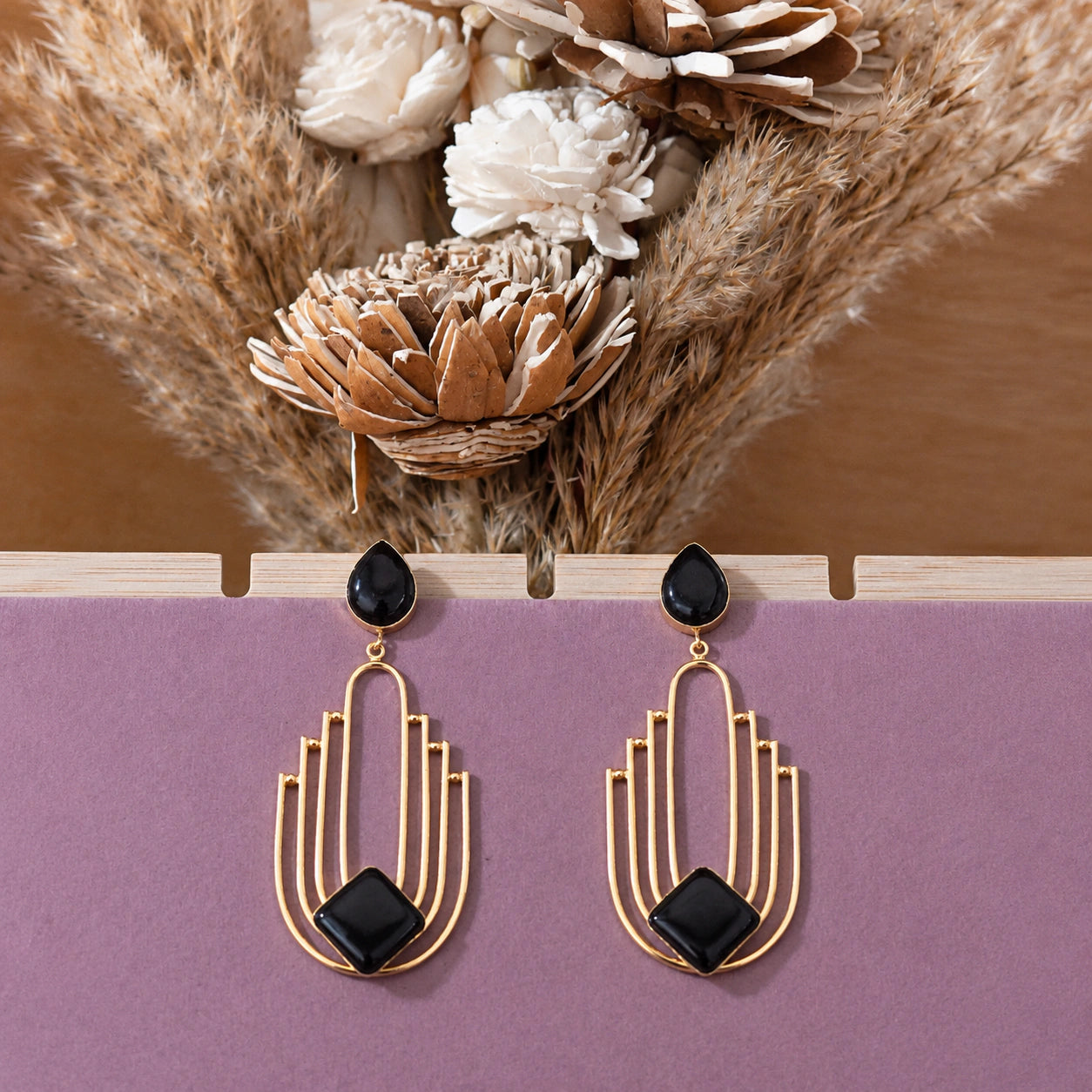 Alternate detail view of black geometric dangle earrings