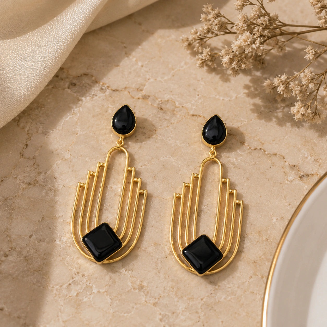 Alternate product view of gold black geometric dangle earrings