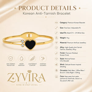 Gold black-heart crystal kada styled in an elegant jewellery flat lay