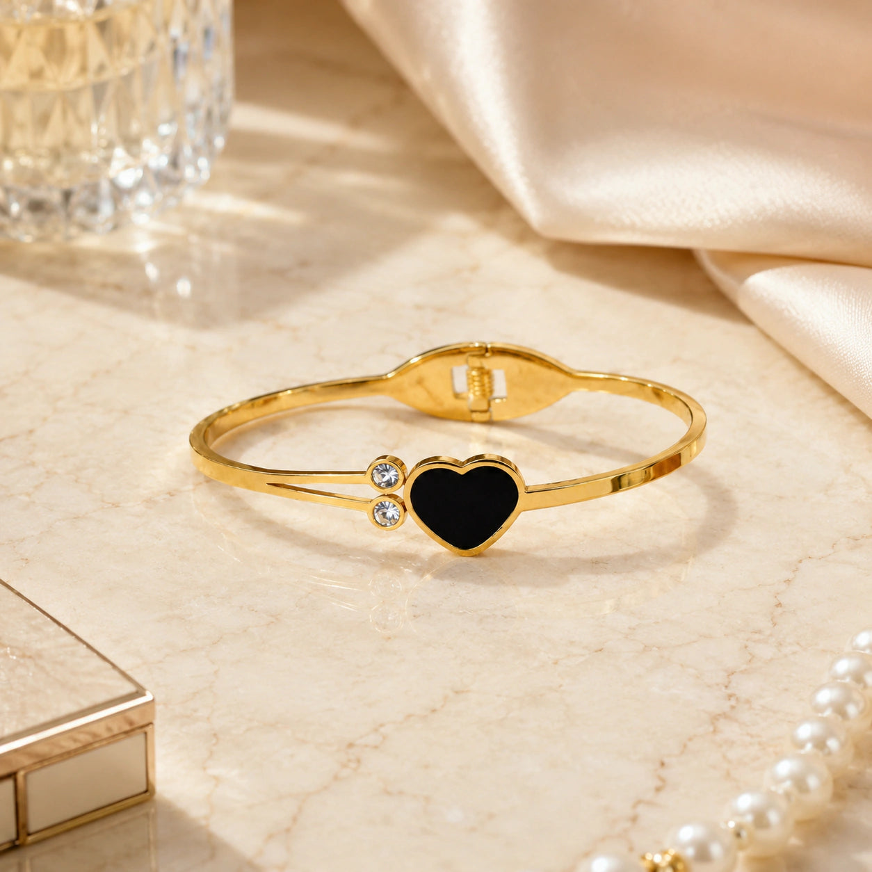 Side view of the gold black-heart double-band kada