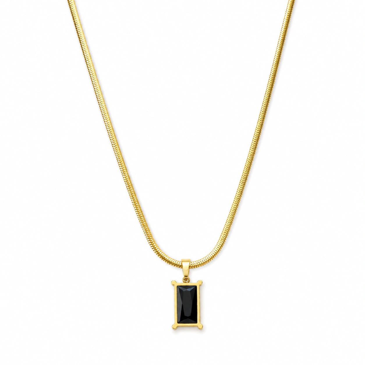 Angled view of the gold black stone snake-chain necklace