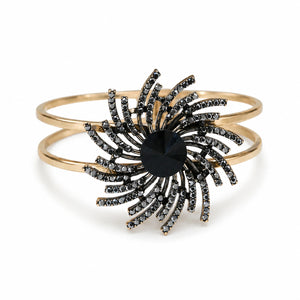 Gold black sunburst double-band kada on a dark jewellery studio display