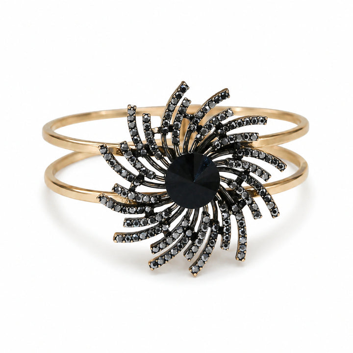 Gold black sunburst double-band kada on a dark jewellery studio display