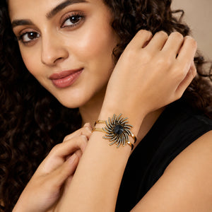 Close-up of the black sunburst and crystal-style detailing