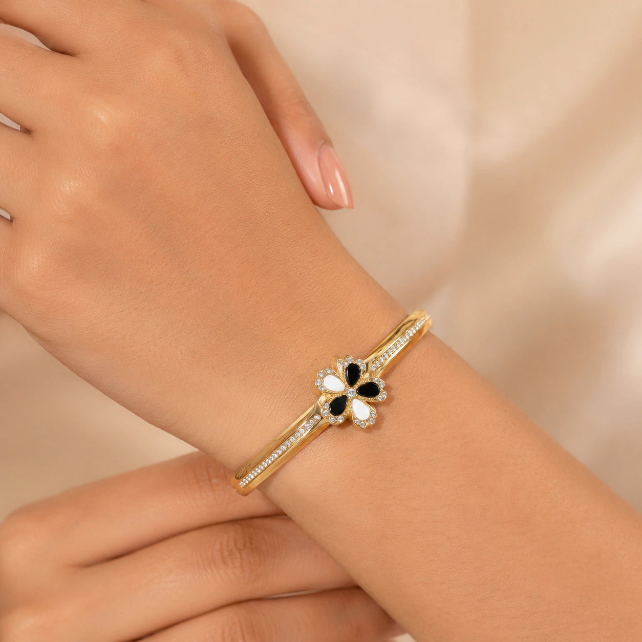 Alternate product view of the gold black and white floral bracelet