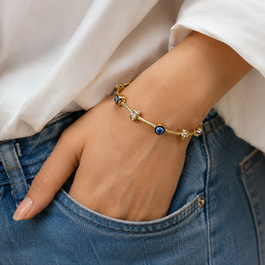 Side view of the gold blue evil-eye crystal bracelet