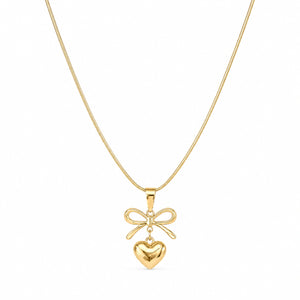 Close-up of the sculpted bow and heart pendant detailing