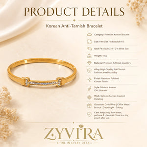 Gold crystal-bar bangle styled in an elegant jewellery flat lay