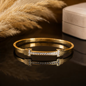 Gold-tone crystal bar rigid bangle bracelet