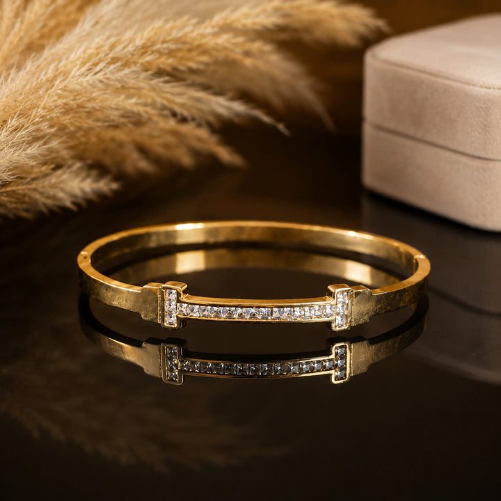 Gold-tone crystal bar rigid bangle bracelet