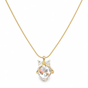 Close-up of the crystal heart and sculpted bow pendant detailing
