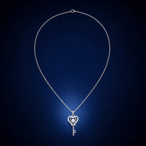 Gold heart key necklace styled in an elegant jewellery flat lay