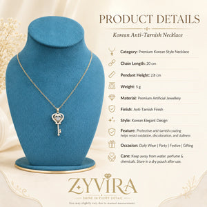 Product details card for the gold crystal heart key necklace