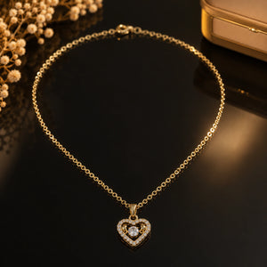 Alternate detail view of the gold crystal open-heart pendant