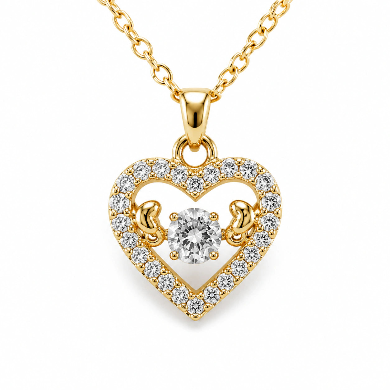 Gold crystal open-heart necklace on a dark jewellery studio display