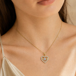 Gold open-heart necklace styled in an elegant jewellery flat lay