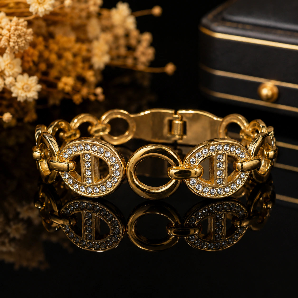 Side view of the gold oval-medallion link bracelet
