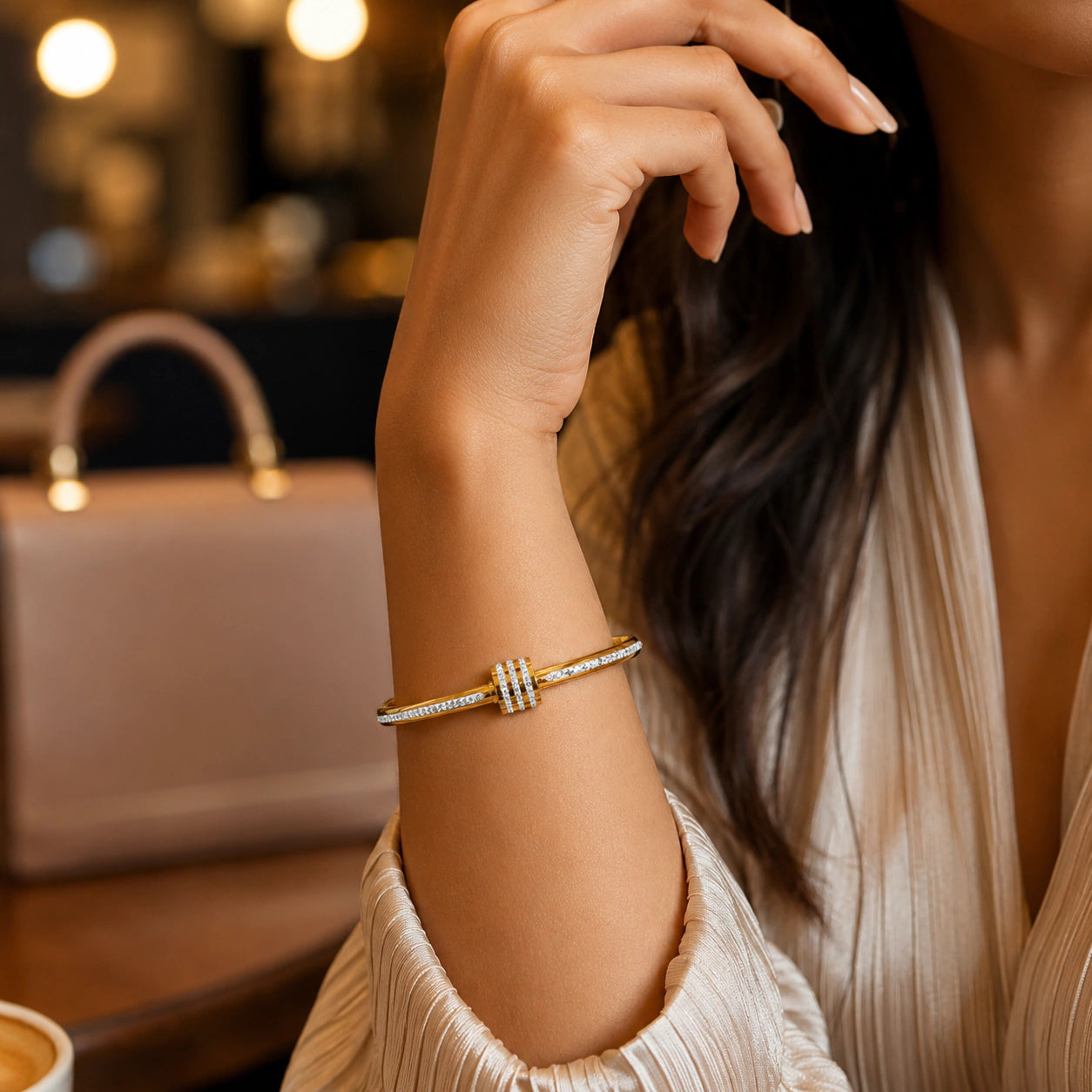 Angled view of the gold crystal teardrop layered kada