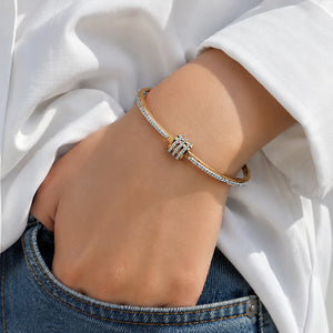 Side view of the gold crystal teardrop layered kada