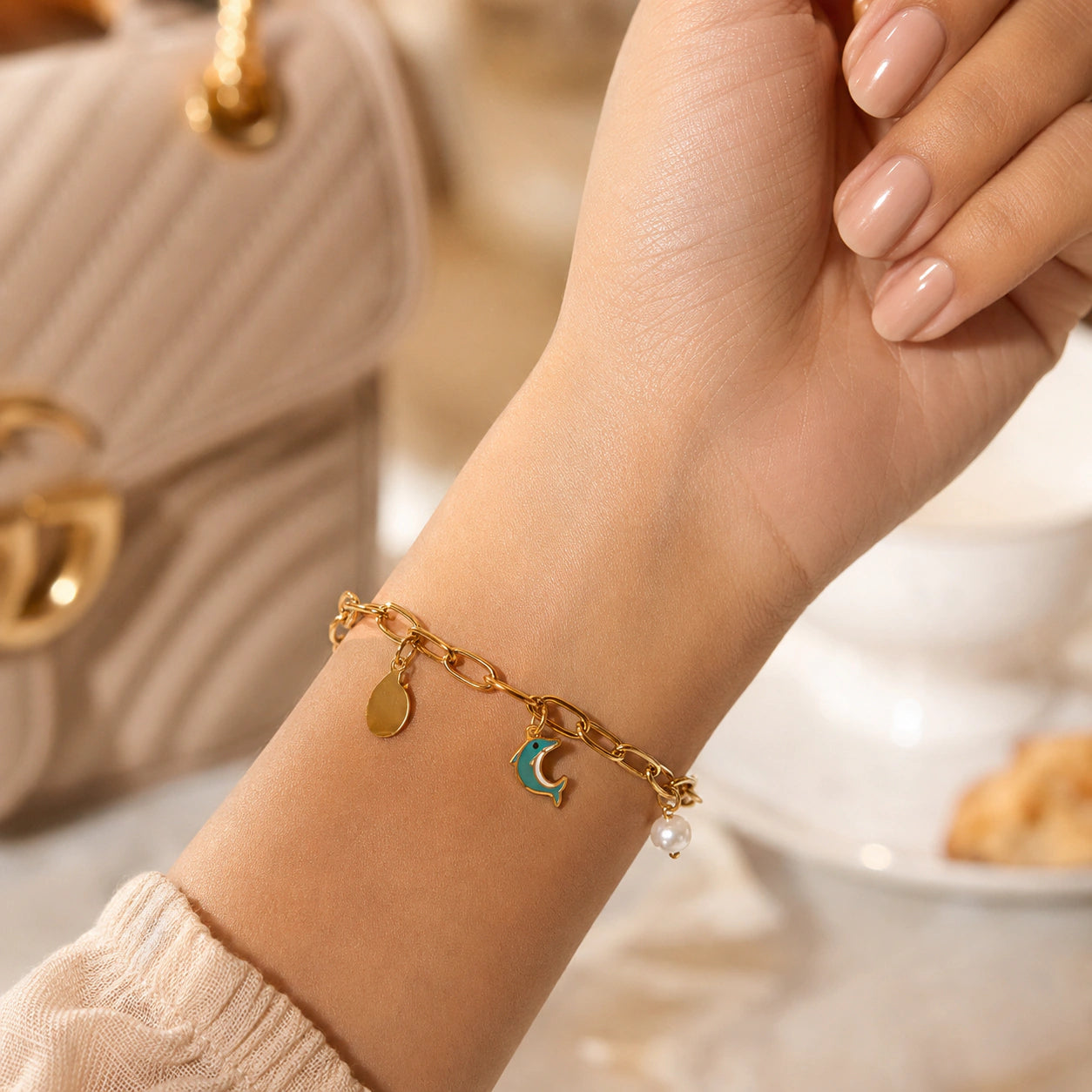 Alternate product view of the gold dolphin pearl charm bracelet