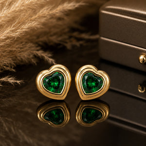 Close-up of emerald heart stones and crystal halo detailing