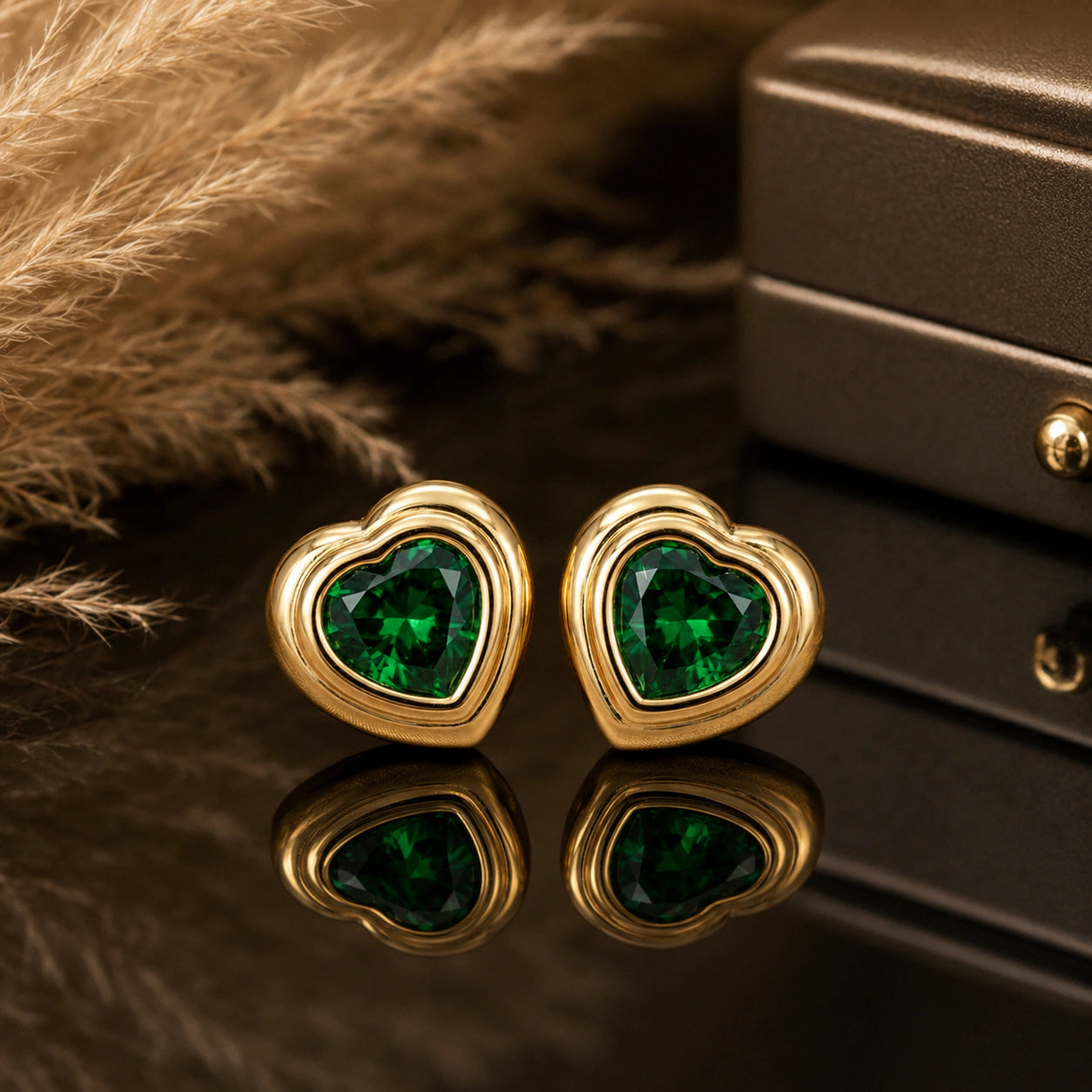 Close-up of emerald heart stones and crystal halo detailing