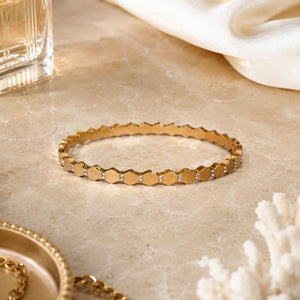 Close-up of faceted geometric links and crystal-style detailing