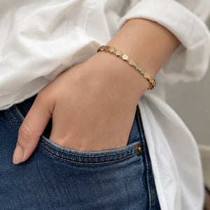 Side view of the gold faceted geometric crystal bracelet