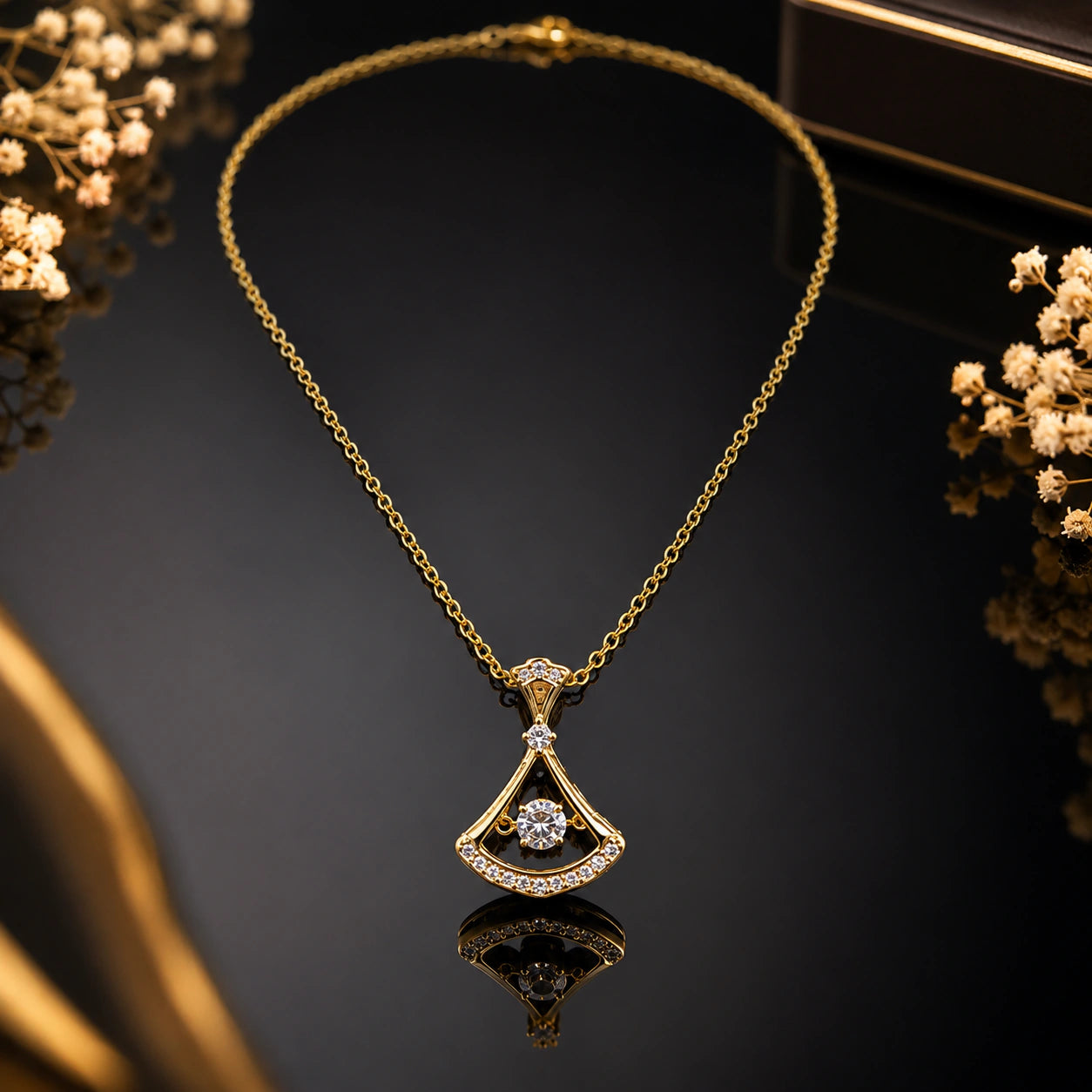 Alternate detail view of the gold fan-frame crystal pendant