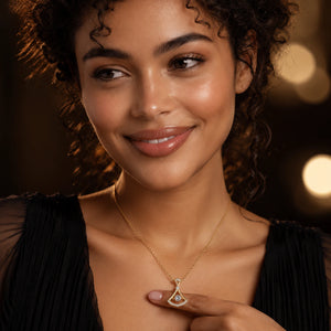 Angled view of the gold fan-frame crystal pendant necklace